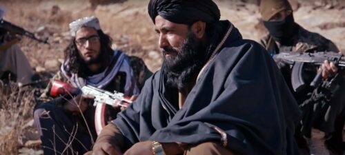 Talibaner sitter i solen