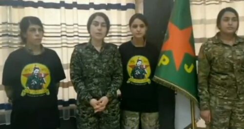 Fyra representanter för milisen YPJ